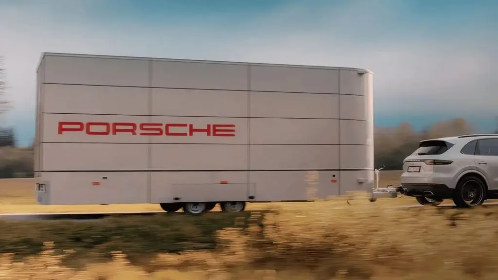The Clear Idea Pulse Elevate mobile event unit exterior at a Porsche dealership in Norway, compact self-contained unit with Porsche branding deployed for customer engagement