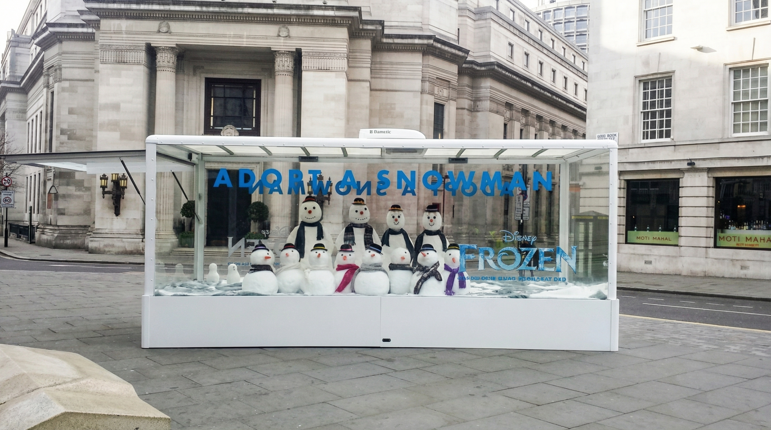 Disney Frozen Adopt A Snowman exterior installation on London street using The Clear Idea Transparent Showcase Box towable exhibition vehicle