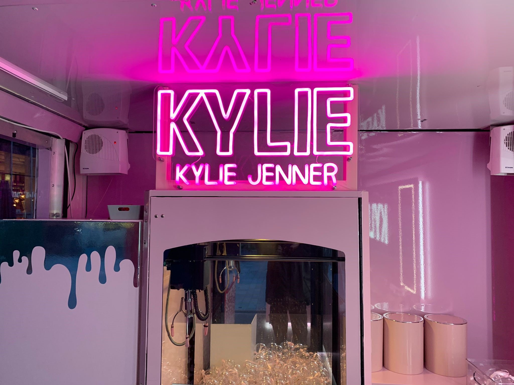 Transparent Showcase Truck by The Clear Idea for Kylie Cosmetics, neon-lit beauty roadshow truck entrance with branded Kylie Jenner display