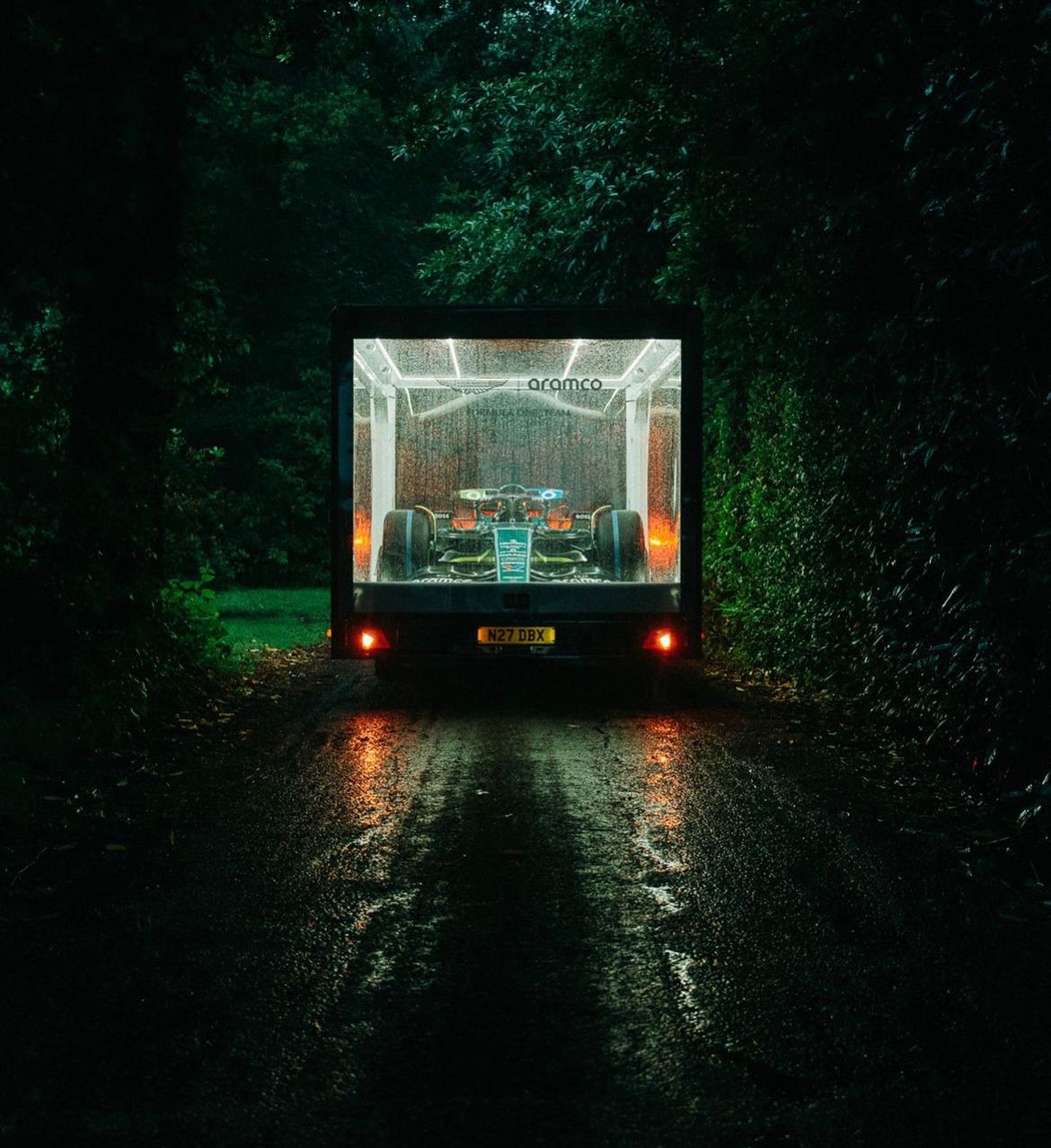The Clear Idea Transparent Showcase Trailer with Aston Martin F1 car on display