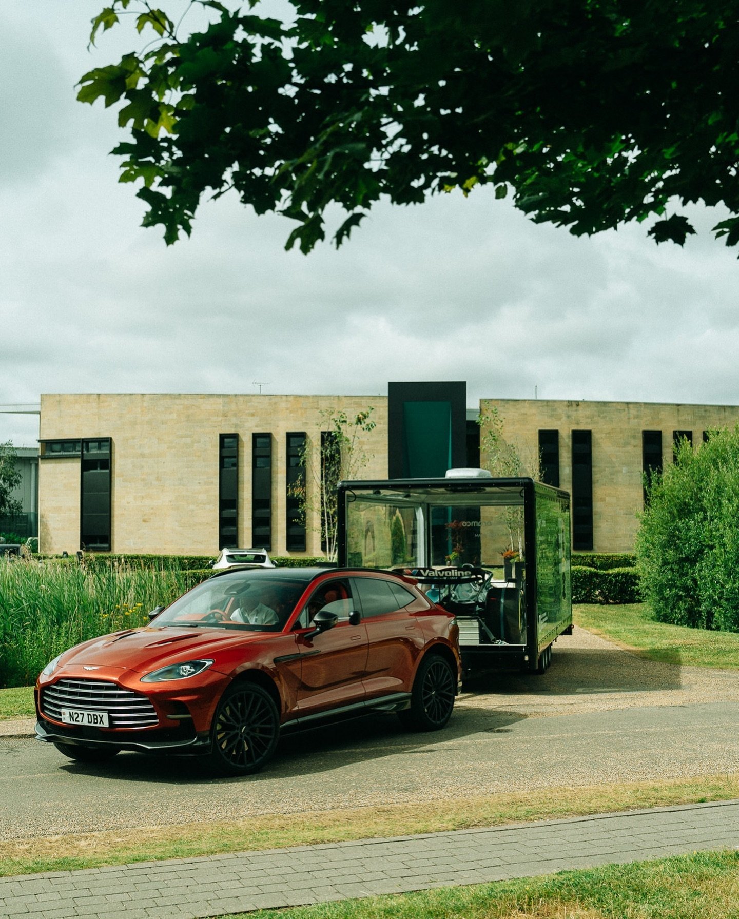 The Clear Idea Transparent Showcase Trailer with Aston Martin F1 car on display