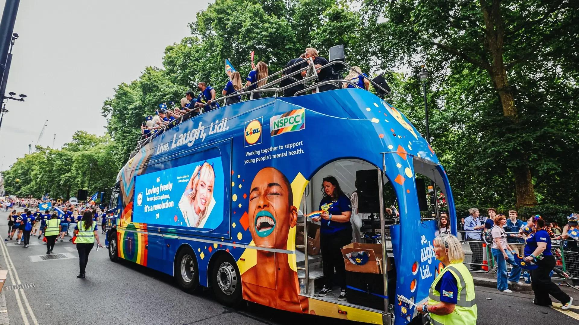 Exhibition Truck For Hire | LED ShowTruck exhibition truck with Lidl Pride branding Live Laugh Lidl wrap and NSPCC partnership at London Pride with performers on upper deck
